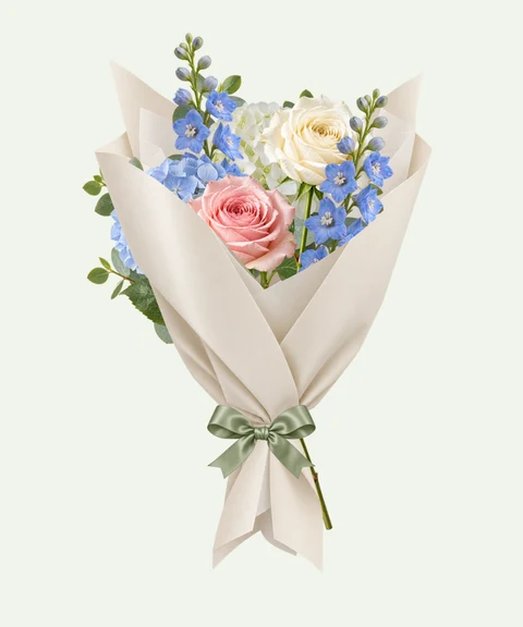 Blue delphinium, white hydrangeas and roses in sculpted ivory paper.