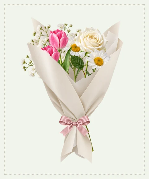 An airy gathering of daisies, pink tulips and warm wishes.
