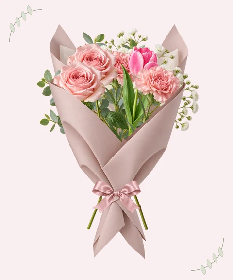 Pink carnations and garden roses, wrapped in blush.