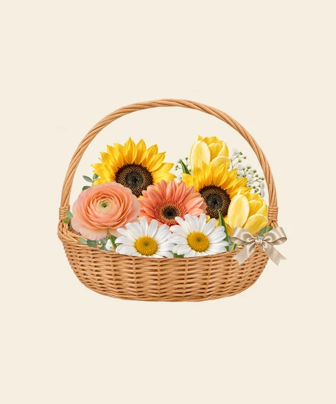 Sunflowers, yellow tulips and peach ranunculus for a cheerful birthday.